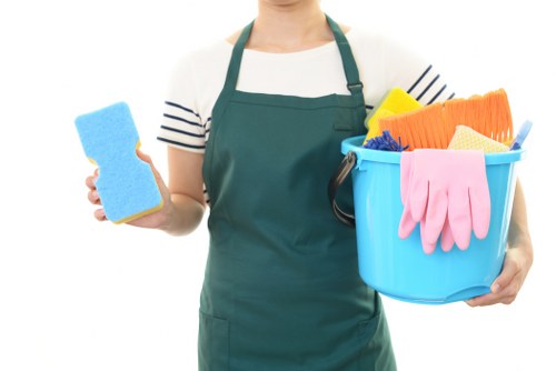 Cleaning professional preparing equipment for a booked Kensington service