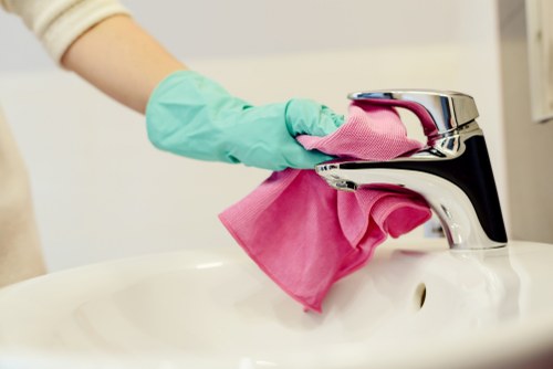 Customer completing a safe Kensington Cleaners payment with card and online options
